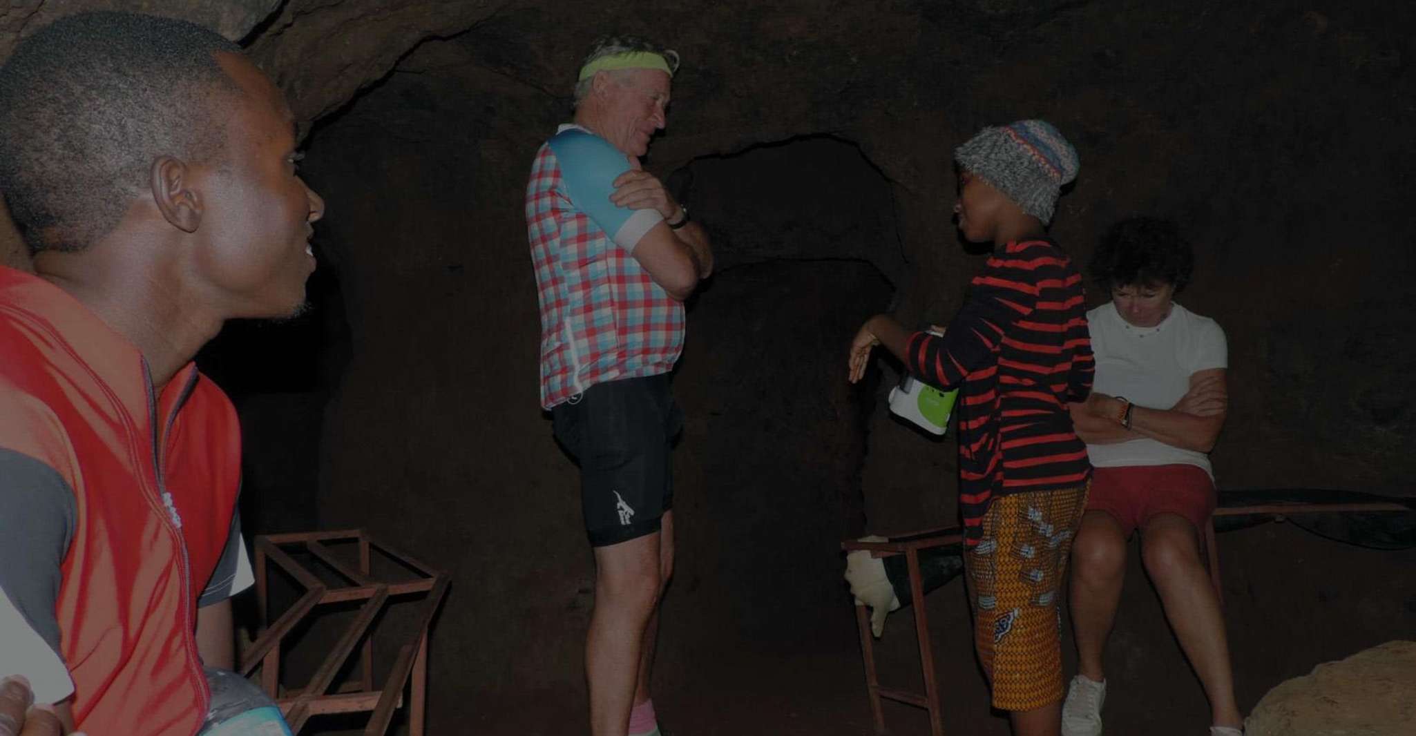 Chagga guide explaining history of the tunnels near Mount Kilimanjaro
